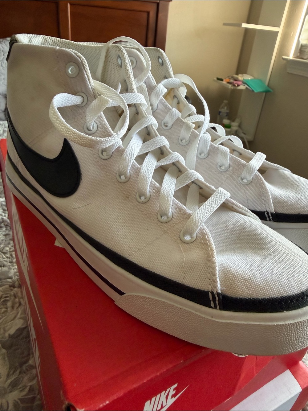 Nike Men’s White High-Top Canvas Sneakers with Black Swoosh